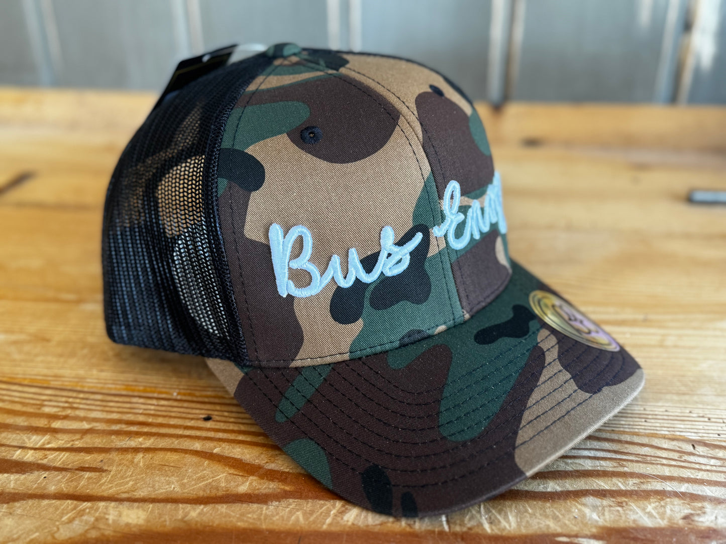 Snap Back Trucker Cap. Cammo & Black. White 3D logo.