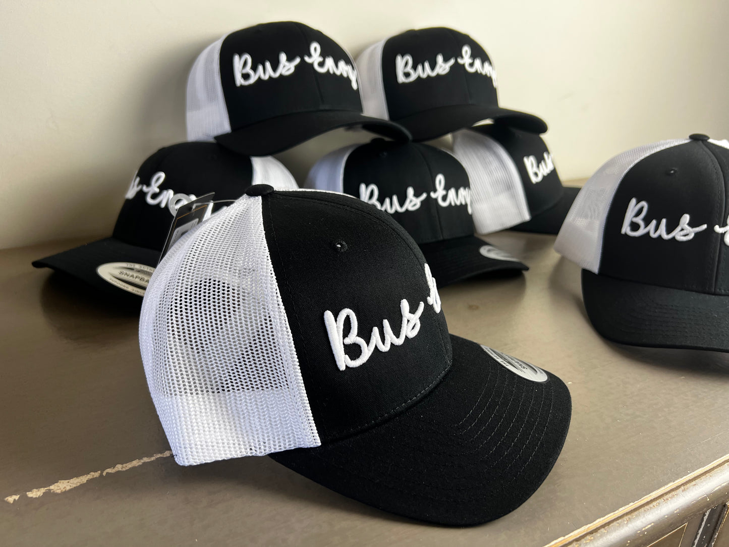 Snap Back Trucker Cap. Black & White. White 3D logo.